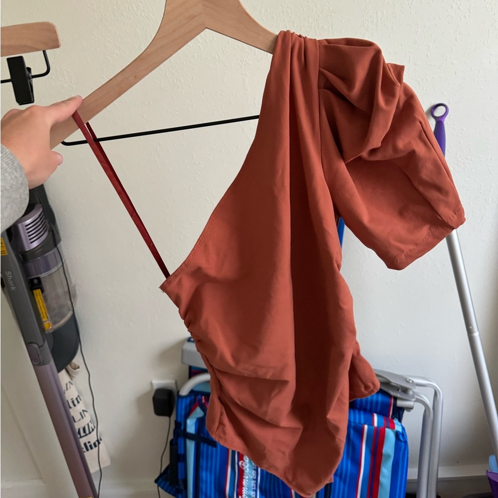 Burnt orange free people one sleeve body suit